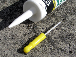 Caulk Cap with unused caulking tube